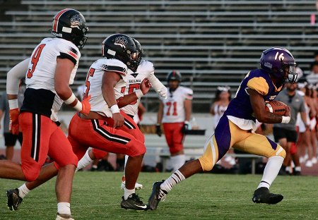 Lemoore's Damian Hernandez runs for a long gain in Friday night's victory over Selma in the season opener in Tiger Stadium. 